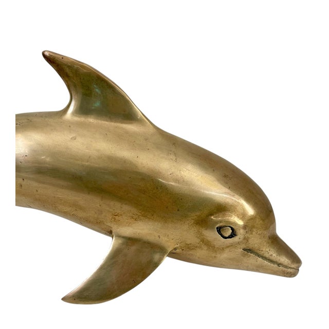 This vintage large brass mid-century dolphin figurine sculpture measures 14 inches tall. Crafted from brass, this detailed...