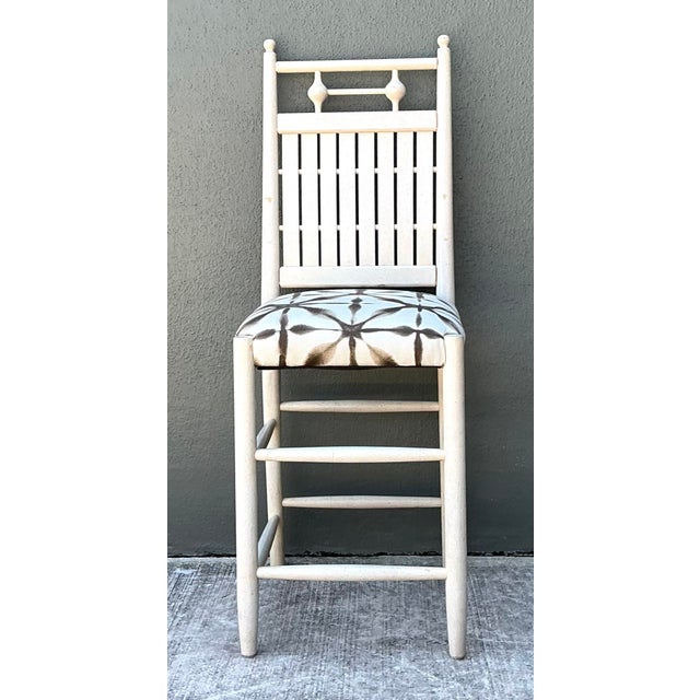 These sophisticated counter stools offer a refined blend of Chinoiserie influence and organic modern texture. Crafted from...