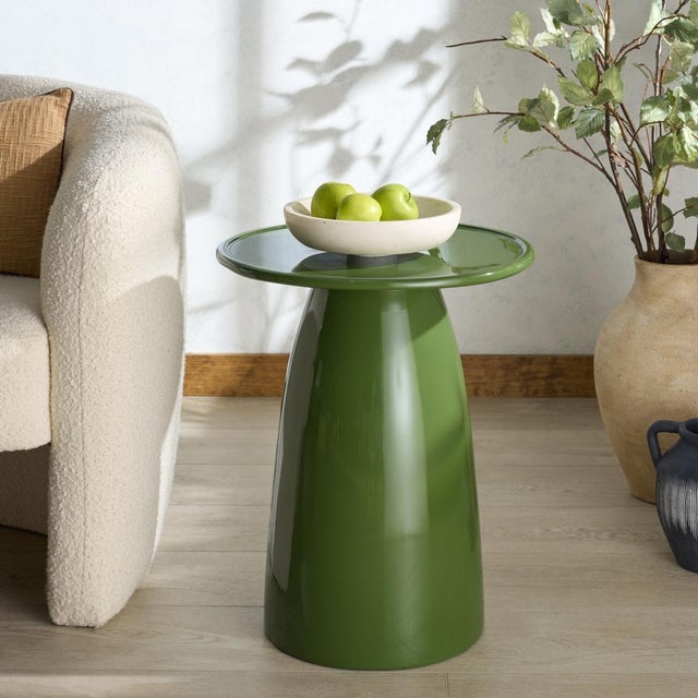 Transform your living space with the captivating Stephan Concrete High Gloss Finish Accent Table in olive green. This...
