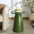 Transform your living space with the captivating Stephan Concrete High Gloss Finish Accent Table in olive green. This...