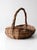 This vintage handmade wicker basket features a softly twisted handle and an open, irregular weave that adds warmth and...
