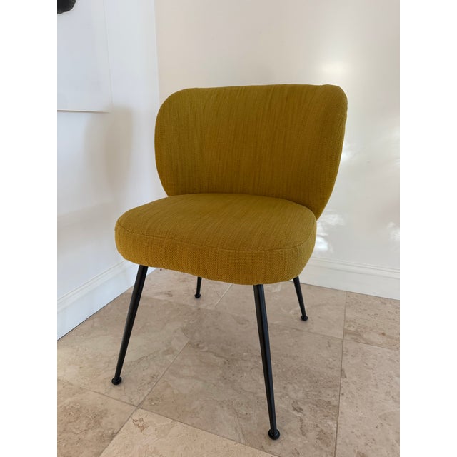 These three West Elm chairs are modern upholstered dining or accent chairs with a sleek, curved silhouette. Very good...