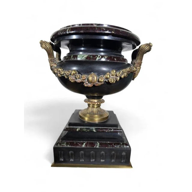 This elegant 19th-century decorative cup combines colorful marble with finely crafted gilt bronze accents, creating a...