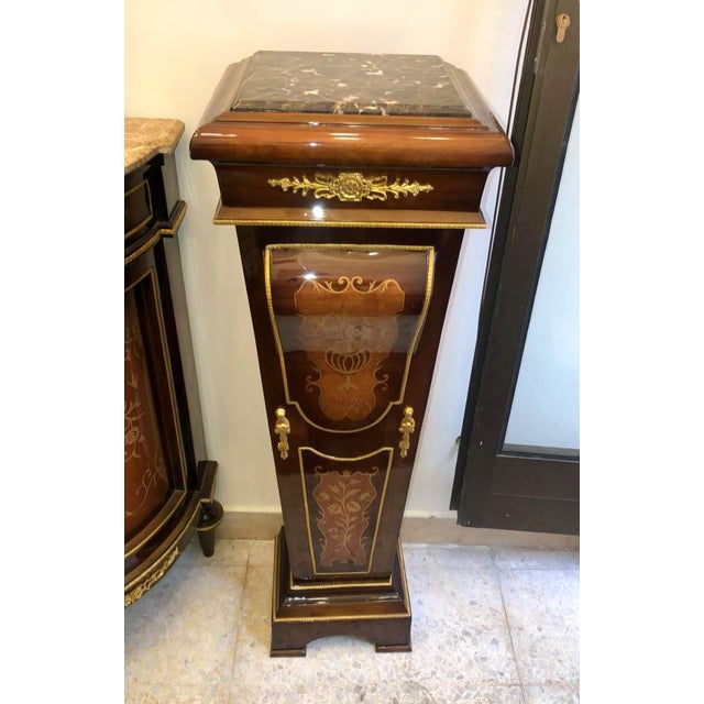 Impressive oversized French Empire-style pedestal crafted from richly finished wood, featuring an elegant marble top and...