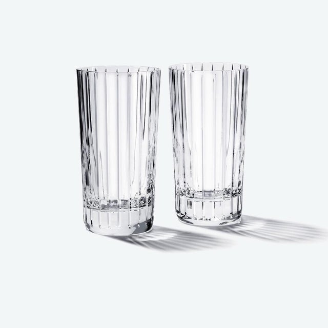 A beautiful set of five Baccarat Harmonie crystal highball glasses featuring the house's celebrated contemporary design....