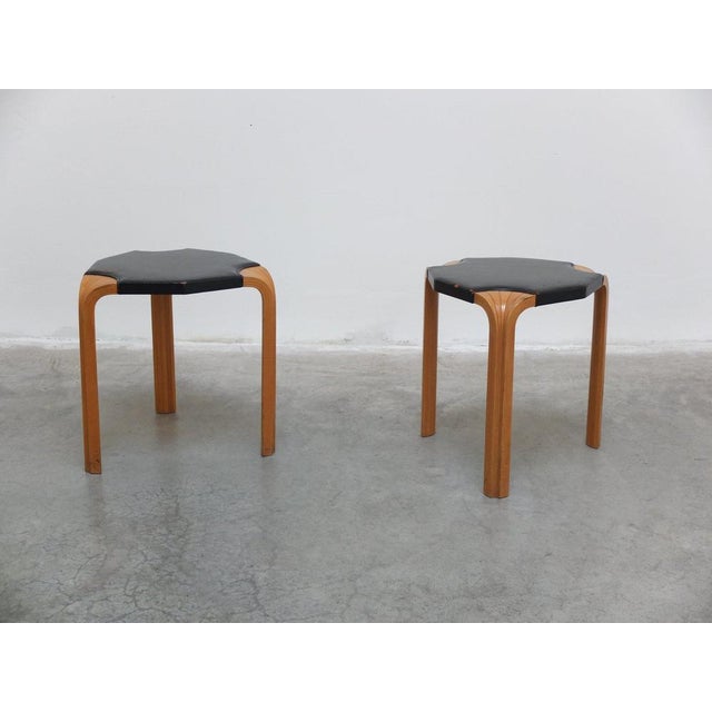 Very rare pair of model ‘X602’ stools designed by Alvar Aalto around 1954. Made of a birch tripod base with exceptional...