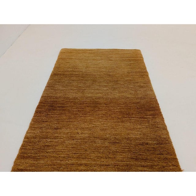 Hand-dyed yarns combine with hard twisted wool create a subtle, striated effect in this group of area rugs. Hand-loomed of...