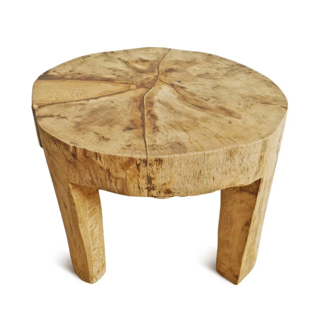 Rustic and beautiful hand ax chiseled raw wood table created from a solid hard wood trunk. Naga tribal indigenous accent...