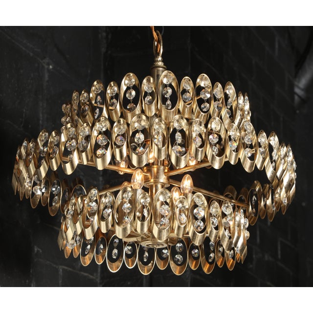 Glowing Gaetano Sciolari Three-Tier Brass and Clear Cut Crystal Hanging Lamp, Circa 1970. Featuring a circular form with...