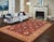 "Enhance the ambiance of your home with this magnificent Persian-influenced Turkish hand-knotted rug made by skilled...
