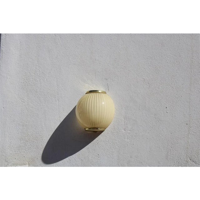 Murano Glass and Brass Wall Lamp, Italy, 1970, in Very Good conditions. Designed 1970 to 1979 European Plug (up to...