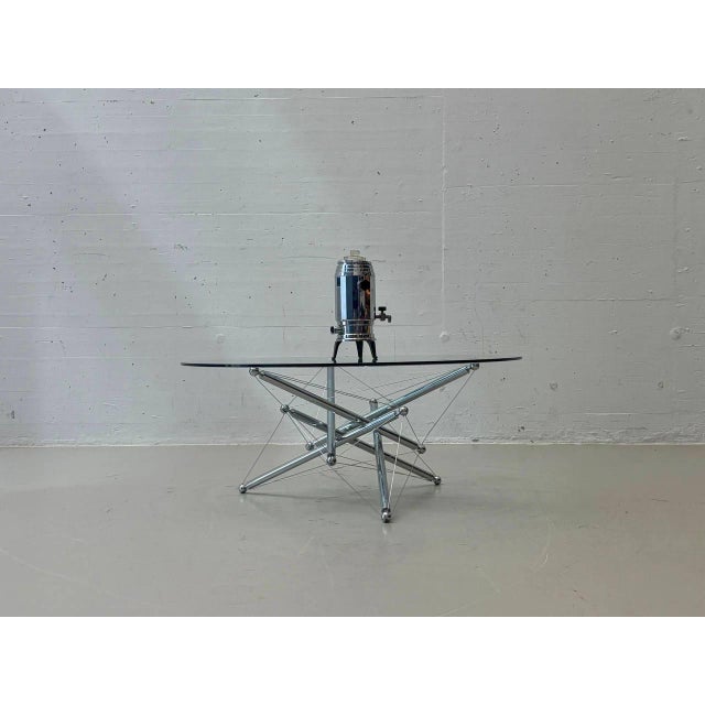 The extraordinary Tensegrity 713 coffee table, designed by Theodore Waddell for Cassina in 1973, is based on the...