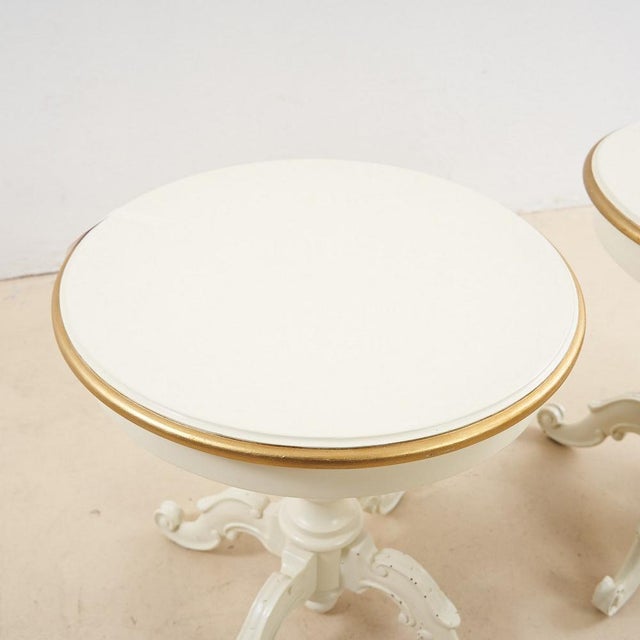 Pair of white lacquered wooden tables with golden details height: 53 diameter: 50 additional information style: antique...