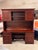 Design Plus Gallery presents a Desk + Hutch from Stuart David. This piece is rendered in a cherry-toned wood veneer with a...