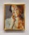 The artwork features a contemplative figure, partially obscured by vivid, textured hues that evoke a sense of...