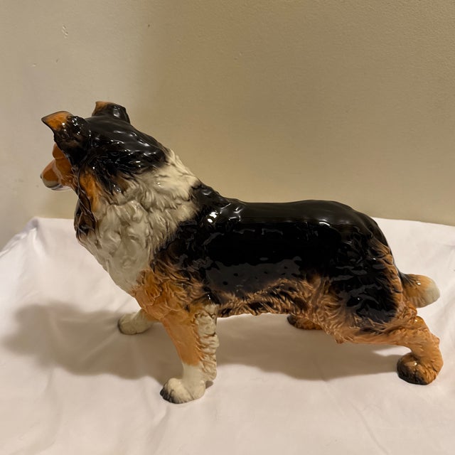 A large scale porcelain Collie figurine crafted by renowned W. Goebel Porzellanfabrik in West Germany. This mid-century...