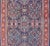 Measures: 9 x 12'1 Colorful Antique Persian Sultanabad Rug with Navy Blue Field and Red Border. Antique Persian Sultanabad...