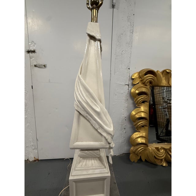 Ornate ceramic lamp with drapery detail, and custom sienna linen shade by Michael Savoia