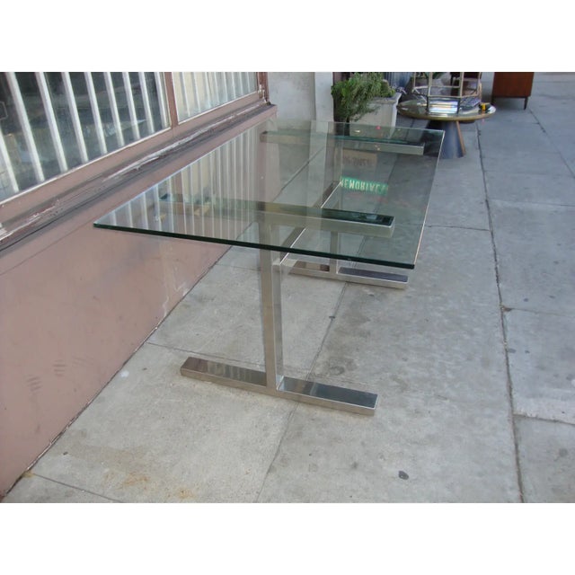 Vintage polished nickel base with glass top desk. Made in the 1930s