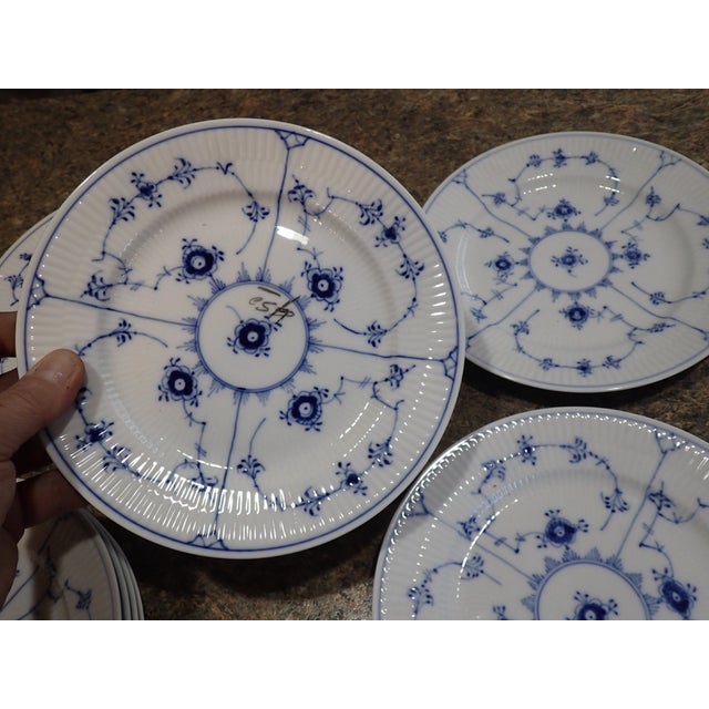 Elevate your table setting with this elegant set of four vintage Royal Copenhagen Blue Fluted Plain salad plates. Crafted...