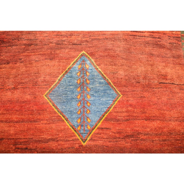 One of a kind 6 foot square Persian Gabbeh rug from the late 20th century Measures: 6'5'' x 6'6''.