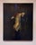 In "Adrift," a figure in a flowing, pale yellow garment floats gracefully against a dark, textured background, evoking a...
