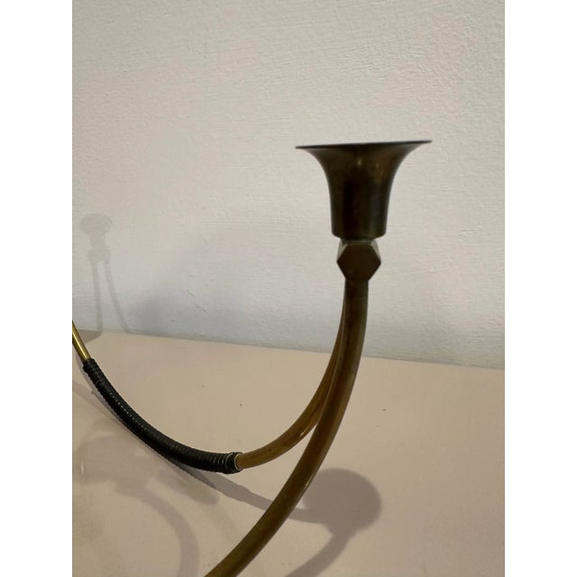 Very cool triple-arm brass candelabra wrapped with black leather for accent. One is good but there are four available to...