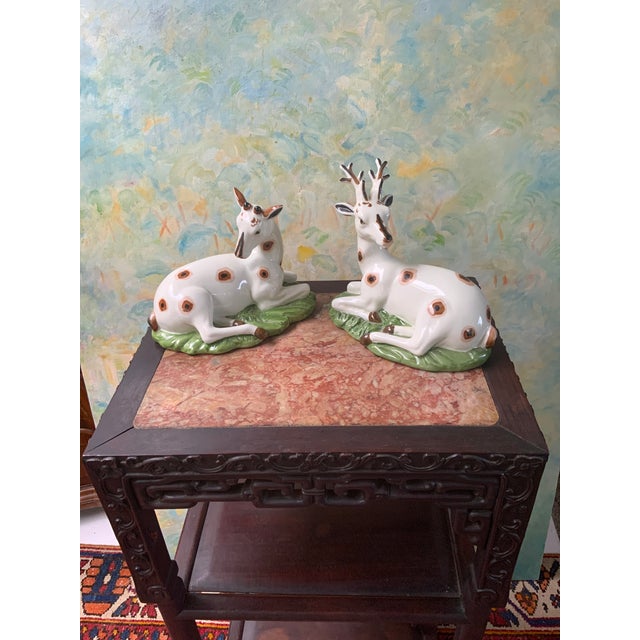 Wonderful Pair Of Porcelain Figures of a Recumbent Antlered Stag Deer and Doe. Finely Cast and Colorfully Glazed...