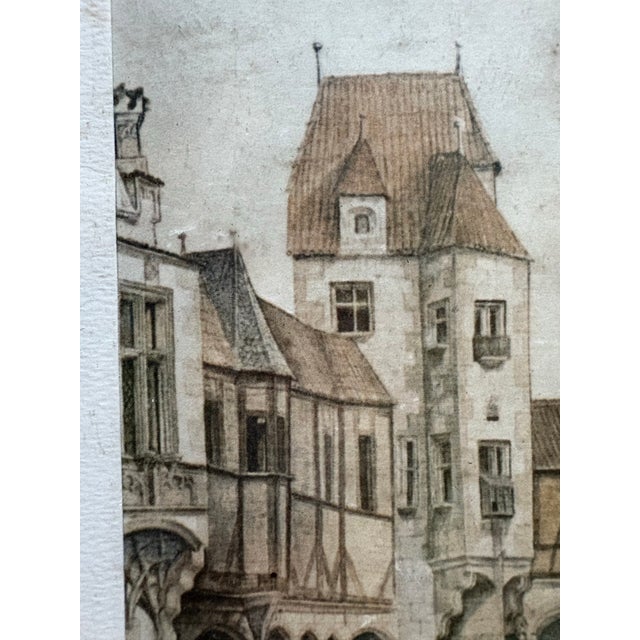 The framed artwork in the image is a print reproduction of the famous watercolor, "Courtyard of the Former Castle in...
