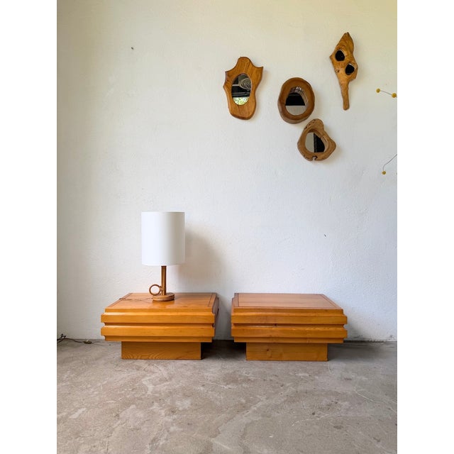 Antique pair of bedside tables in light elm from maison regain. we love their unique look with its graphic cutouts and the...