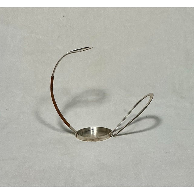 Vintage Mid-Century Modern silver-plated wine bottle holder by E. L. ELPORT Germany, circa 1960s. This piece is often...