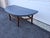Beautiful half moon coffee table with bamboo-esque frame and stone like top. Dimensions 21.5. W. 16.25 H. 21.75 D...
