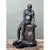 This vintage bronzed terracotta sculpture captures a contemplative seated male figure, perched thoughtfully atop a rough-...