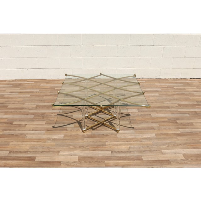 An iconic Charles Hollis Jones “Treillage” coffee table, showcasing the designer’s signature combination of lucite,...
