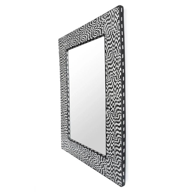 Striking vintage wall mirror with amazing Escher-like pattern frame made from black and white resin pattern. Unique modern...