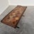 A striking vintage french coffee table combining rustic materials with a strong architectural presence. The rectangular...