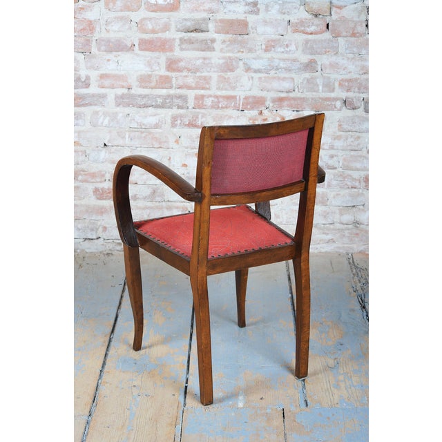 This set of four luxurious dining armchairs is a magnificent example of high French Art Deco from the 1930s. The...