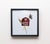 This artwork features a striking red barn silhouette accompanied by a delicate wheat stalk and a detailed bee, all set...