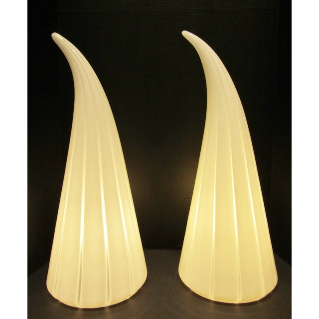 These large Italian Murano glass table lamps feature a stunning design of white and striped horn-shaped shades, adding a...
