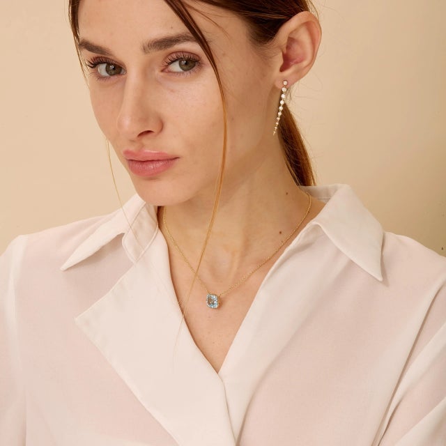 Created in 18 karat yellow gold Blue Topaz 5 carats approx. 18 inch chain with loops at 16th and 17th inch Crafted from 18...