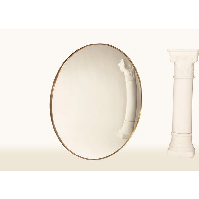 On this page, a round convex mirror with a diameter of 120 cm, featuring an antique brass frame and classic mirror glass....