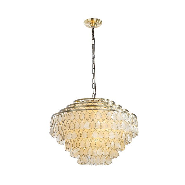 This ALOADECOR four-tier chandelier is made with aged bronze tone hardware and layered natural teardrop-shaped Capiz...