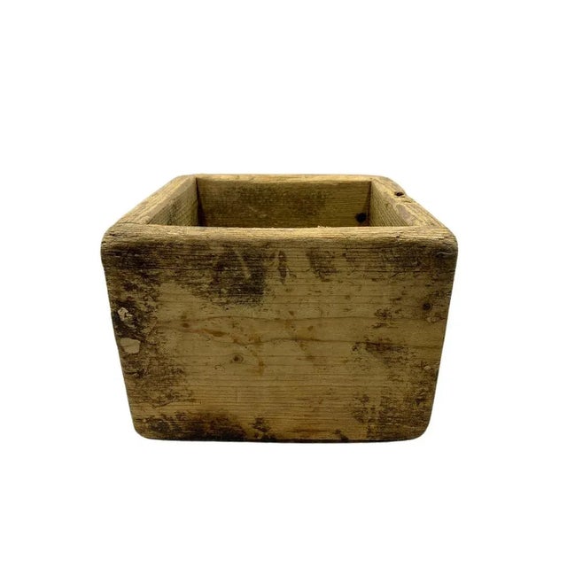 This antique small wooden box hails from Hungary, exuding rustic charm and rich cultural heritage. Its compact size hints...