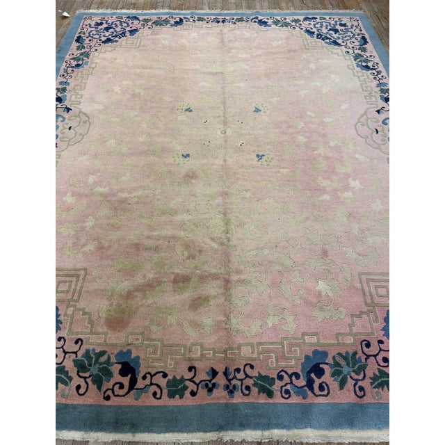 This is a gorgeous and highly authentic room-sized antique Chinese rug, cataloged under Measuring a very popular and...