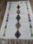 One-of-a-kind handwoven Azilal rug from Morocco. An ivory ground scattered with whimsical multicolor arrow motifs in...
