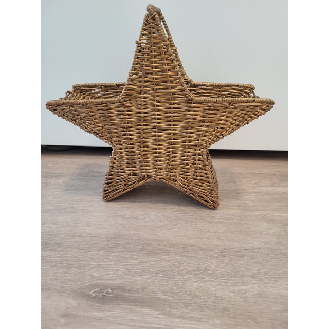 Lovely gold wicker basket. Handle at the top for easy carrying or hanging