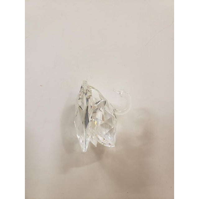 This is a Swarovski Crystal Closed Wing Swan Figurine. It measures 1 7/8" high and 2 1/2“ long. The piece is in excellent...