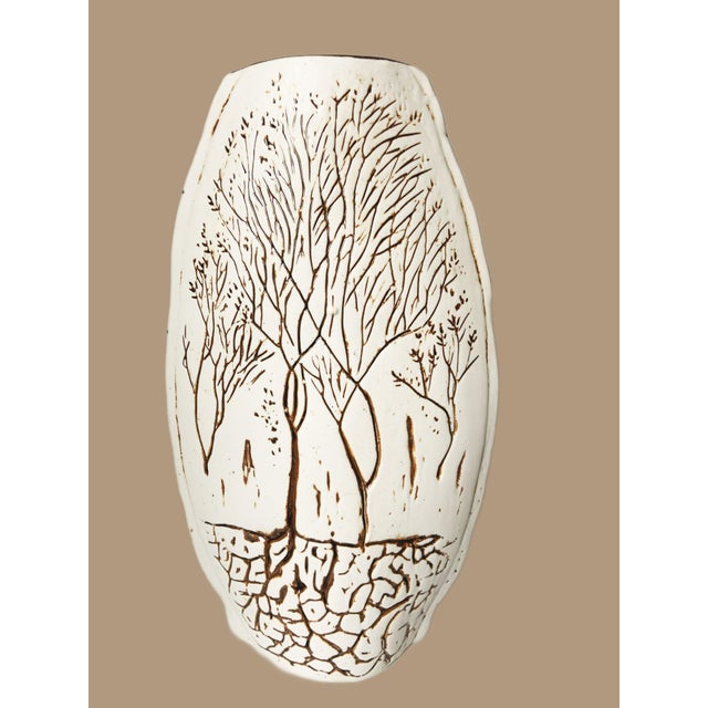 This vintage Tenmoku handmade incised pottery vase is a striking piece that beautifully captures the essence of natural...