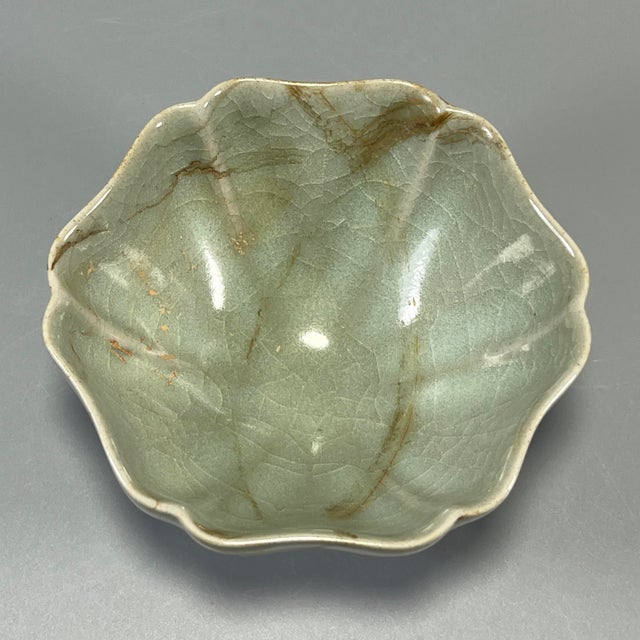 Classic Chinese celadon lobed flower‑form bowl with natural crackle glaze. Delicate floral petal shape, soft pale green...