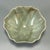 Classic Chinese celadon lobed flower‑form bowl with natural crackle glaze. Delicate floral petal shape, soft pale green...